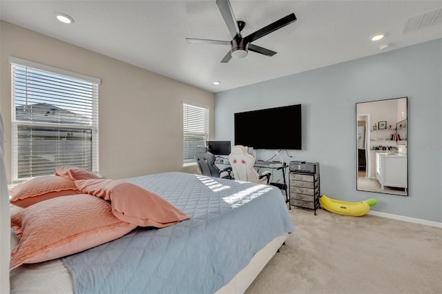 carpeted bedroom with ceiling fan