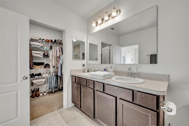 bathroom with tile patterned flooring and vanity