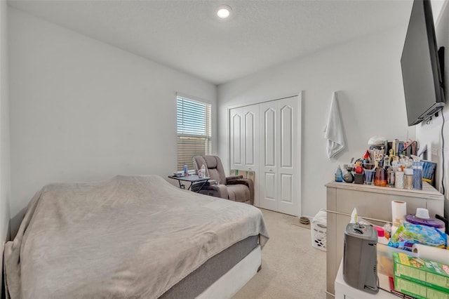 carpeted bedroom featuring a closet