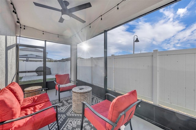 sunroom / solarium with ceiling fan