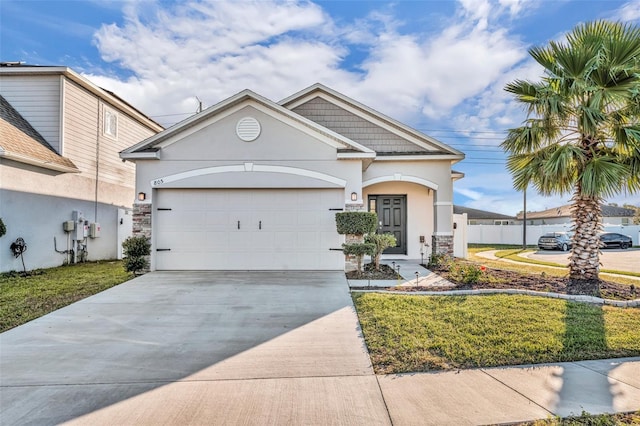 view of front of home featuring a garage and a front lawn