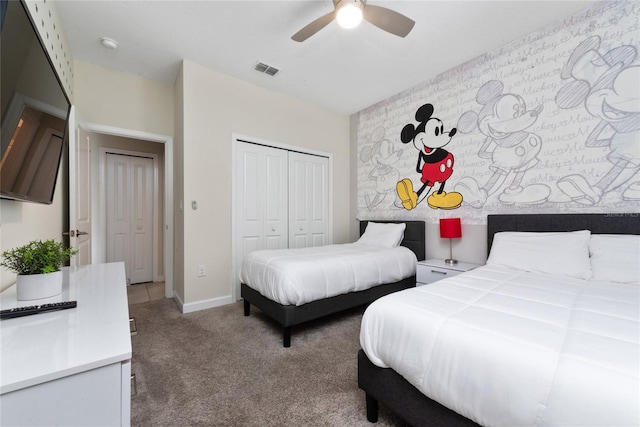 bedroom with ceiling fan, a closet, and carpet floors