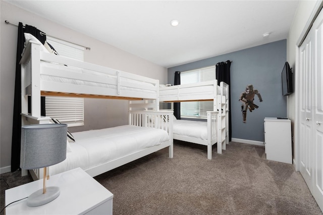 carpeted bedroom featuring a closet