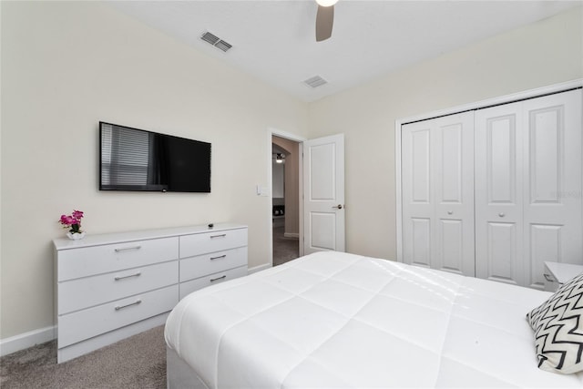 carpeted bedroom featuring ceiling fan and a closet