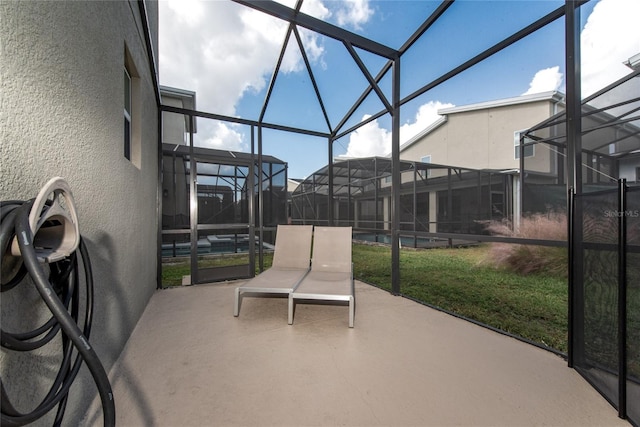 view of patio / terrace featuring a lanai