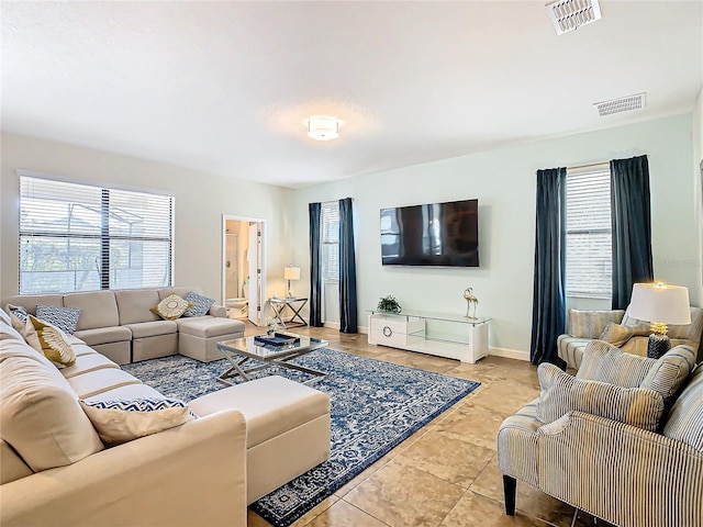 living room with light tile patterned floors