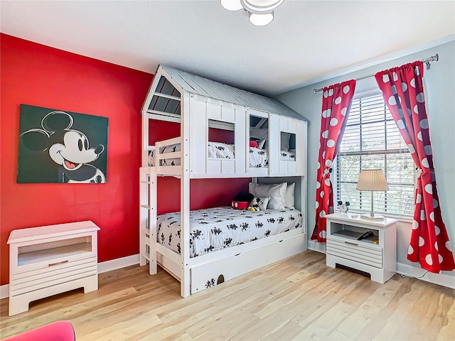 bedroom featuring wood-type flooring