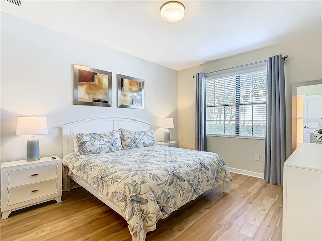 bedroom with light wood-type flooring