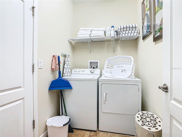 laundry area with washing machine and clothes dryer