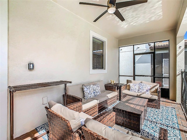 view of patio / terrace with an outdoor living space and ceiling fan