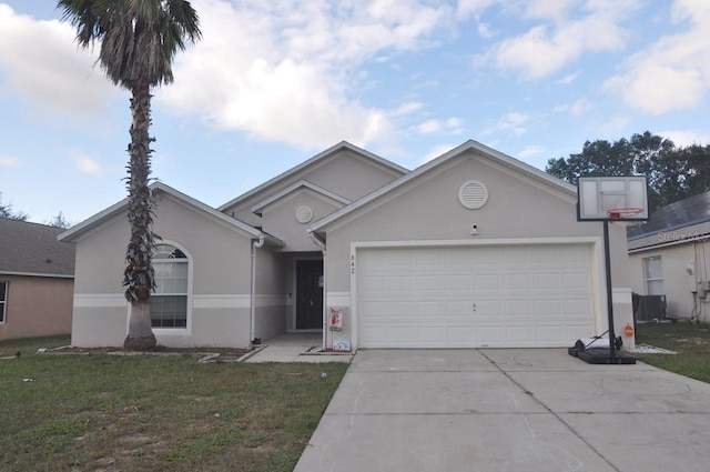 ranch-style home featuring a garage and a front lawn