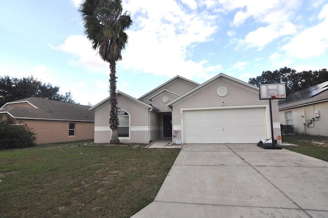 view of front of home with a front lawn and a garage