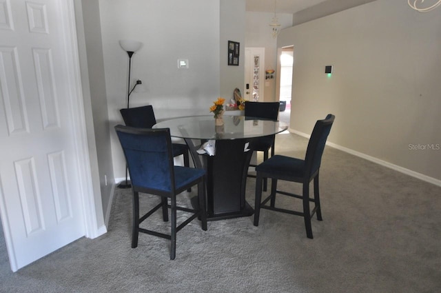 view of carpeted dining space