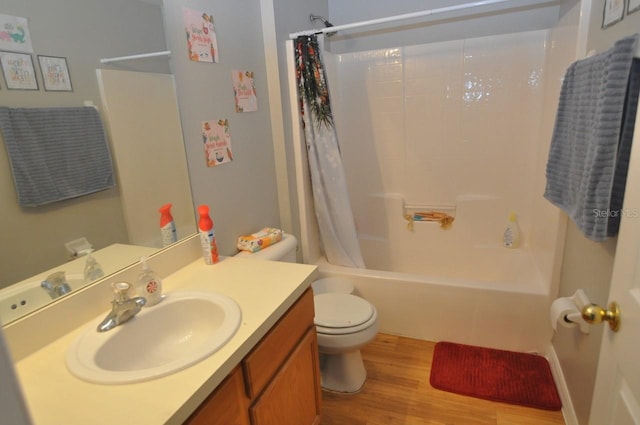 full bathroom with wood-type flooring, vanity, shower / bath combo, and toilet