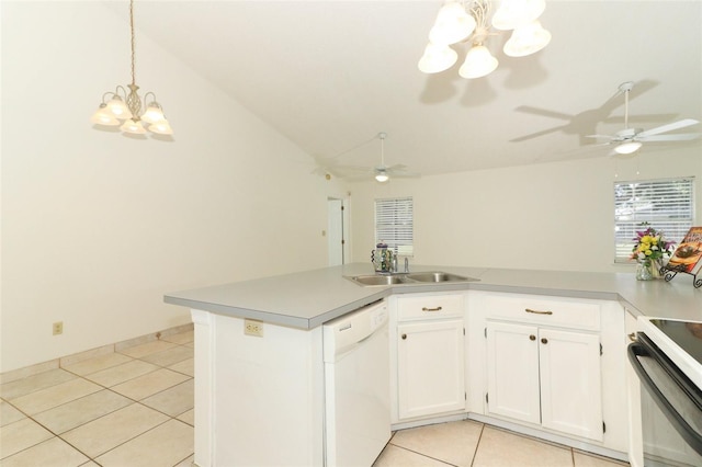 kitchen with dishwasher, lofted ceiling, sink, and white cabinets