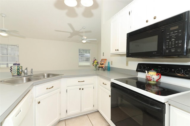 kitchen with white cabinets, white appliances, light tile patterned floors, and sink