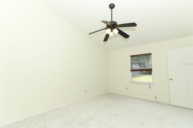 unfurnished room featuring ceiling fan, light carpet, and lofted ceiling