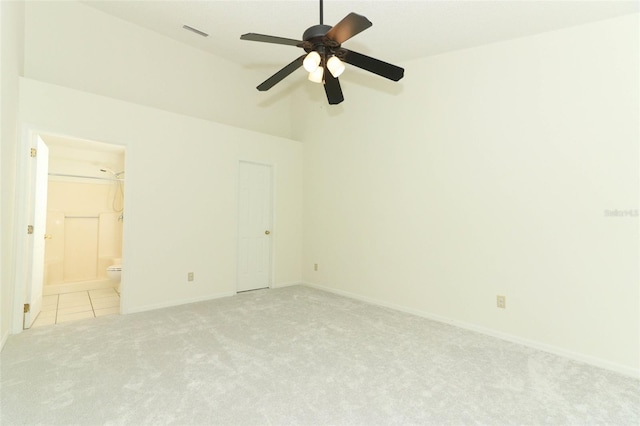 unfurnished room with high vaulted ceiling, light carpet, and ceiling fan