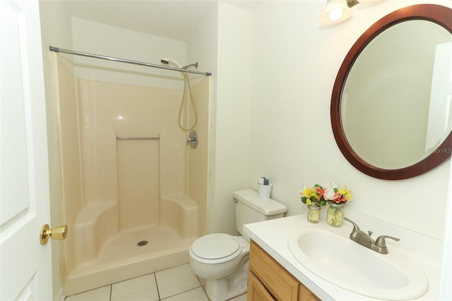 bathroom with walk in shower, tile patterned flooring, vanity, and toilet