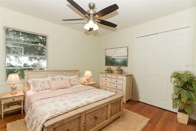 bedroom featuring a closet, hardwood / wood-style flooring, and ceiling fan