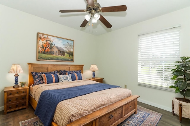 bedroom featuring ceiling fan and dark hardwood / wood-style flooring