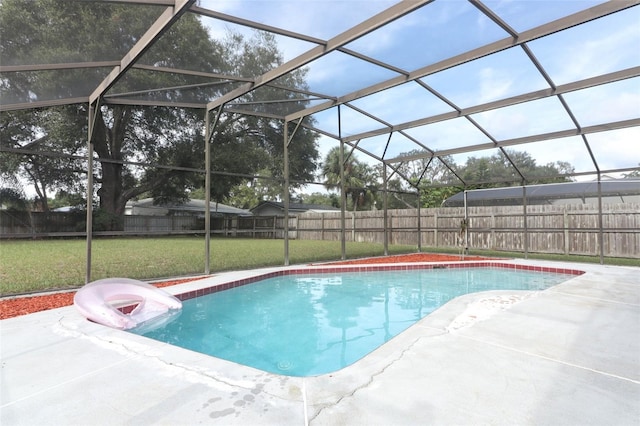 view of swimming pool featuring a lanai, a patio, and a yard