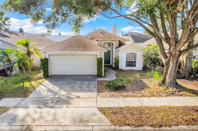 ranch-style home featuring a garage