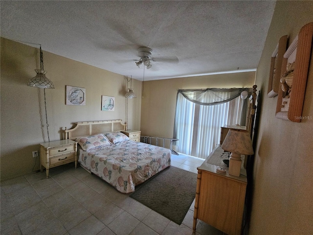 721 S Beach St Unit 217A, Daytona Beach, FL 32114 - bedroom featuring a textured ceiling and ceiling fan