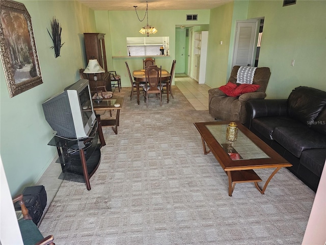 721 S Beach St Unit 217A, Daytona Beach, FL 32114 - tiled living room featuring a chandelier