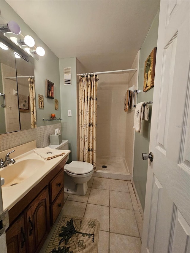 721 S Beach St Unit 217A, Daytona Beach, FL 32114 - bathroom with toilet, vanity, a shower with shower curtain, and tile patterned flooring