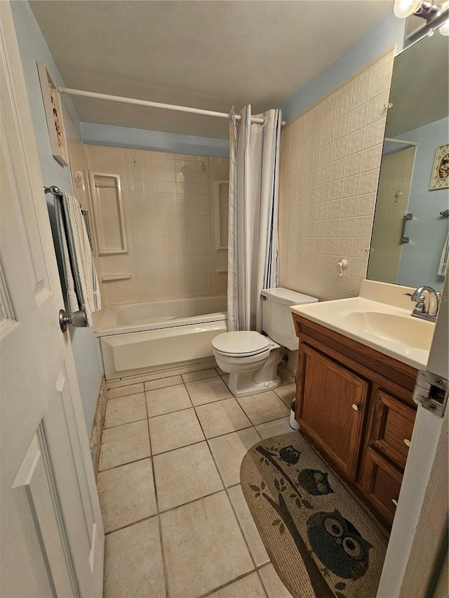 721 S Beach St Unit 217A, Daytona Beach, FL 32114 - full bathroom featuring toilet, vanity, shower / bath combination with curtain, and tile patterned flooring