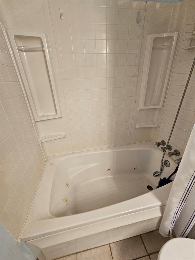 721 S Beach St Unit 217A, Daytona Beach, FL 32114 - bathroom with tile patterned floors, shower / bath combo, and toilet