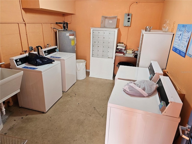 721 S Beach St Unit 217A, Daytona Beach, FL 32114 - washroom featuring sink, independent washer and dryer, and gas water heater