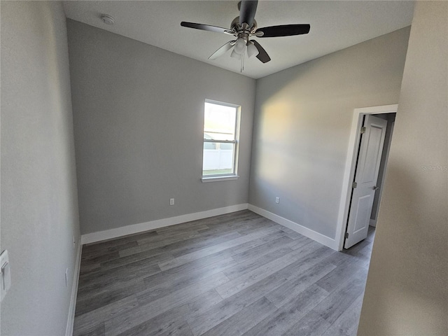 empty room featuring ceiling fan and wood-type flooring