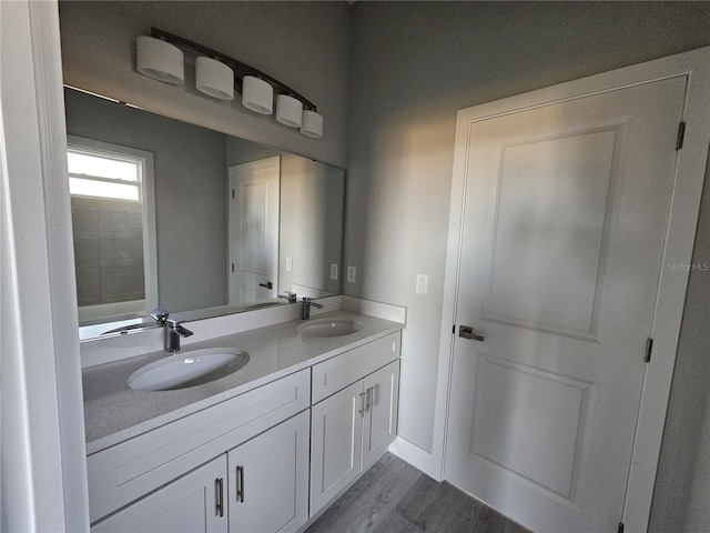 bathroom featuring vanity and hardwood / wood-style flooring