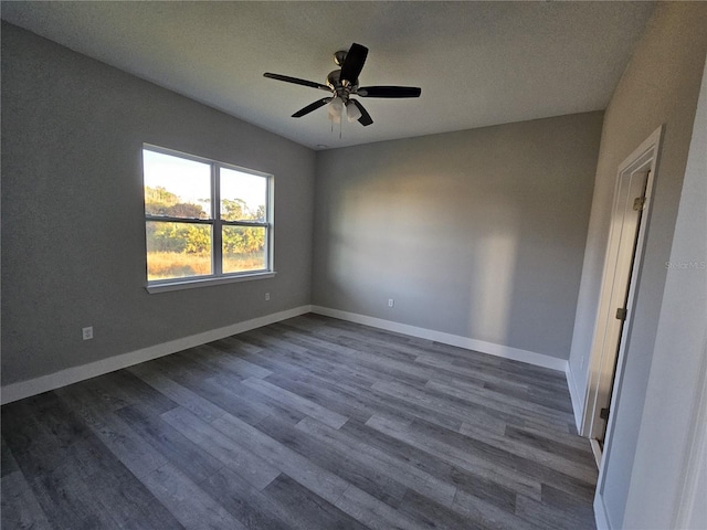 unfurnished room featuring a textured ceiling, dark hardwood / wood-style flooring, and ceiling fan