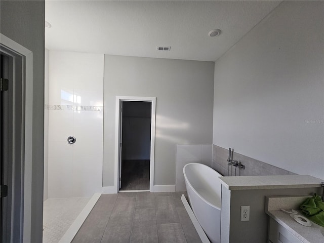 bathroom with shower with separate bathtub and hardwood / wood-style flooring