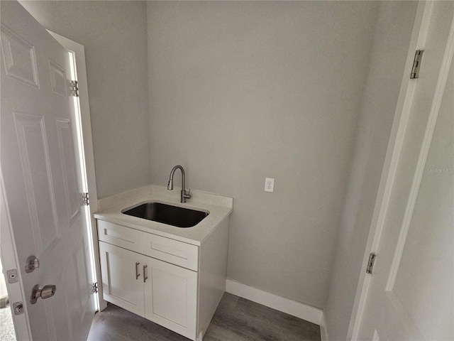 bathroom with hardwood / wood-style floors and vanity