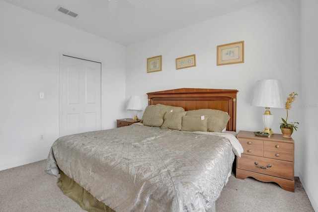 bedroom with carpet flooring and a closet