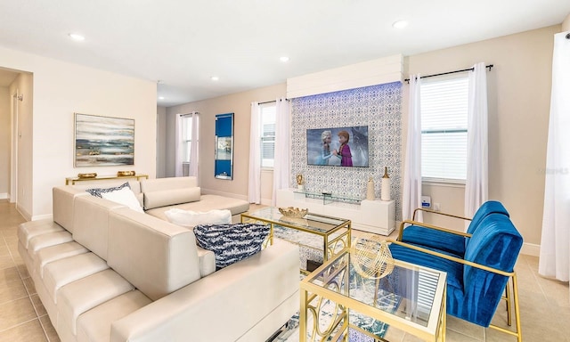 living area with recessed lighting, a healthy amount of sunlight, and light tile patterned floors