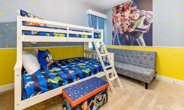 bedroom featuring wallpapered walls, baseboards, and carpet flooring