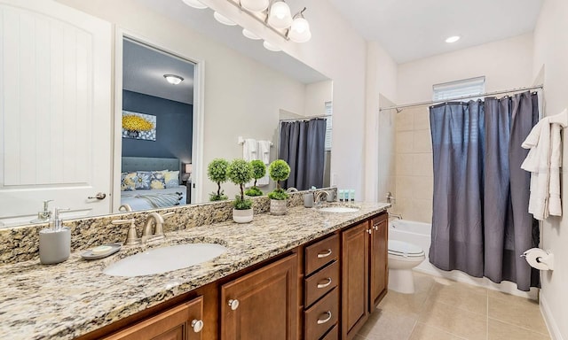 ensuite bathroom featuring ensuite bathroom, shower / tub combo, tile patterned flooring, and a sink