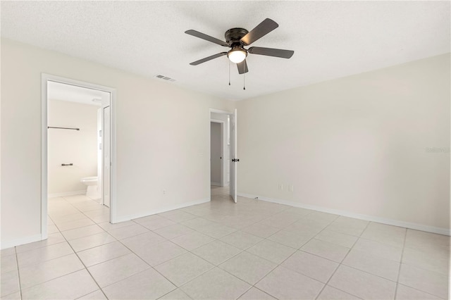 interior space featuring a textured ceiling and ceiling fan