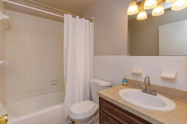 full bathroom featuring vanity, shower / bath combination with curtain, tile walls, and toilet