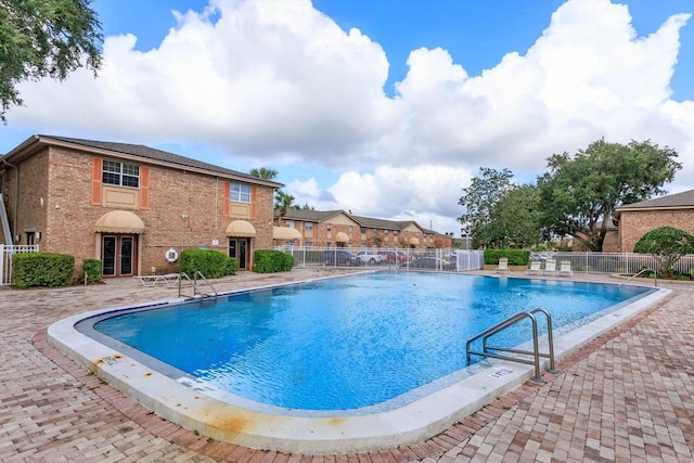 view of swimming pool featuring a patio