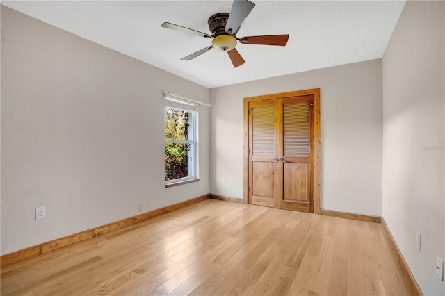 unfurnished bedroom featuring a closet, ceiling fan, and light hardwood / wood-style flooring