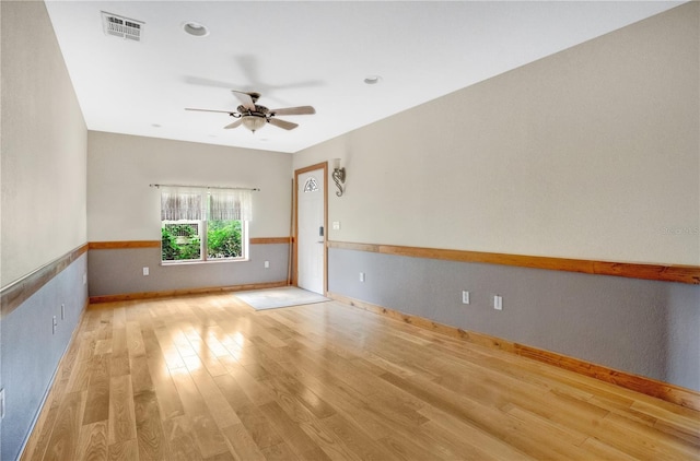 unfurnished room with light hardwood / wood-style flooring and ceiling fan