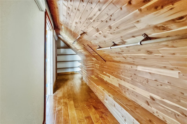 bonus room featuring wood walls, wood-type flooring, and wood ceiling