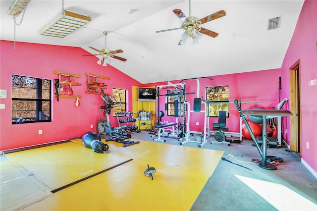 exercise area featuring ceiling fan and lofted ceiling