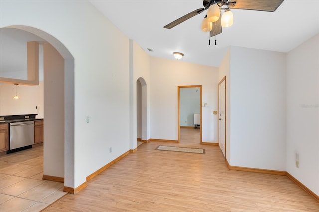 unfurnished room featuring ceiling fan and light hardwood / wood-style flooring